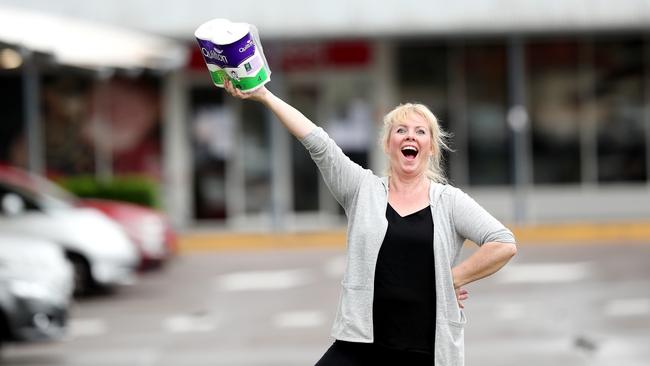 Sally Loughnan sings in the toilet paper aisle at Coles Lisarow to try and make people smile. Picture: Sue Graham