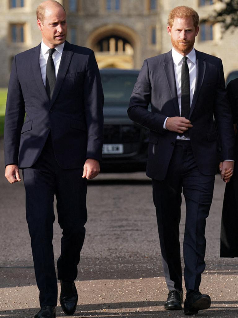 William and Harry walk side-by-side outside Windsor Castle, a rare display of unity for the estranged brothers. Picture: AFP