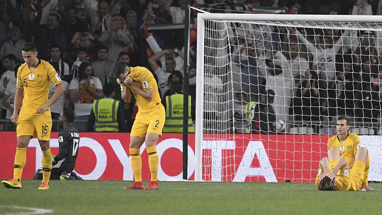 Australian players react after the AFC Asian Cup quarterfinal soccer match between United Arab Emirates and Australia at Hazza Bin Zayed Stadium in Al Ain, United Arab Emirates, Friday, Jan. 25, 2019. United Arab Emirates won the match 1-0. (AP Photo/Hassan Ammar)