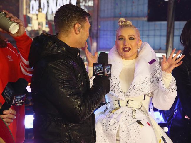 Ryan Seacrest and Christina Aguilera speak on stage during Dick Clark's New Year's Rockin' Eve With Ryan Seacrest. Picture: AP