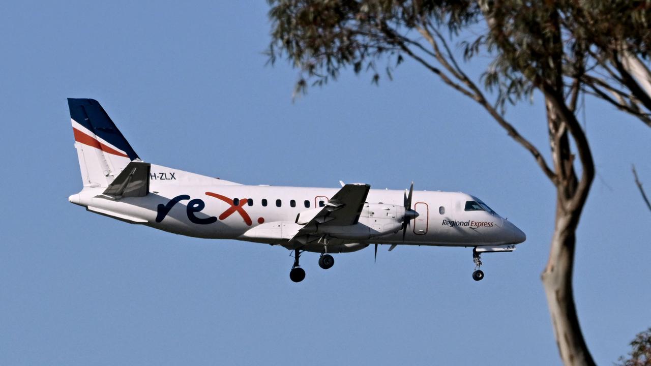 A Rex Airlines Saab 340B prepares to land at Melbourne's Tullamarine Airport on July 30, 2024 after the Australian regional airline announced a trading halt and thus fuelling speculations of financial challenges. (Photo by William WEST / AFP)