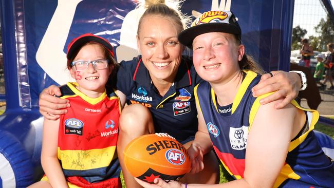 Adelaide supporters can get up close and personal with the stars at members’ days. AFLW great Erin Phillips meets fans Leah Speck, 11 (left) and Tamsyn Speck, 14. Picture: Dean Martin