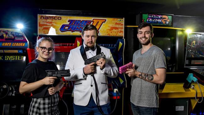 Gamer Georgia Mitchell with Checkpoint esports events organiser and cupid Nathan Farmer and Jack Skinner. Photo: Jerad Williams