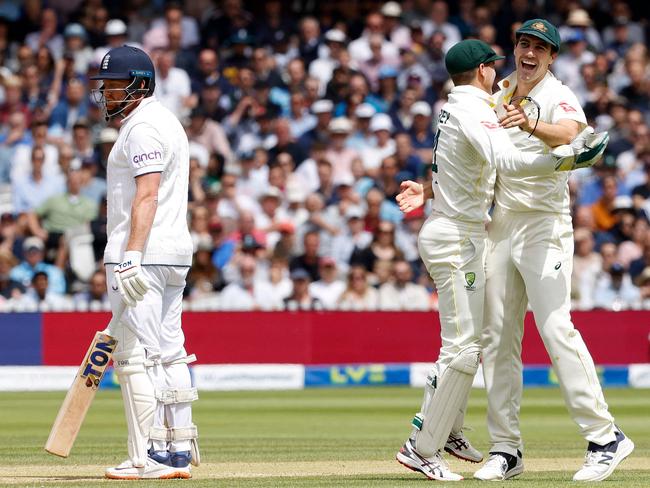 Australia's Pat Cummins (R) and Australia's wicket keeper Alex Carey (C) celebrate taking the wicket of England's Jonny Bairstow for 10 runs on day five of the second Ashes cricket Test match between England and Australia at Lord's cricket ground in London on July 2, 2023. (Photo by Ian Kington / AFP) / RESTRICTED TO EDITORIAL USE. NO ASSOCIATION WITH DIRECT COMPETITOR OF SPONSOR, PARTNER, OR SUPPLIER OF THE ECB