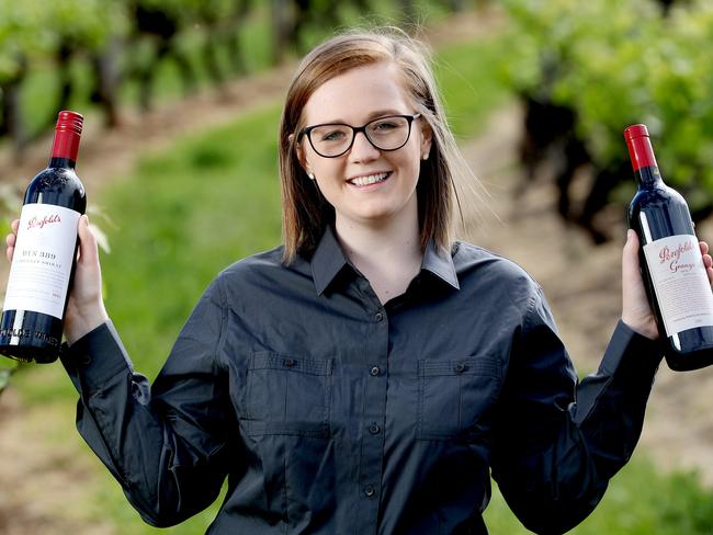 NEW VINTAGE: Milly Cottrell from Penfolds Magill Estate with the new Grange and Bin 389. <b>Picture: CALUM ROBERTSON</b>