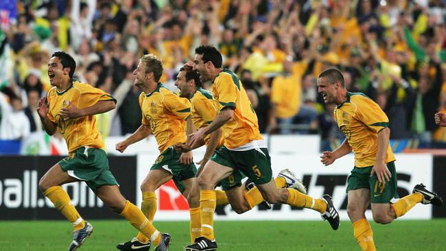 The Socceroos celebrate after winning the second leg of the 2006 FIFA World Cup qualifying match between Australia and Uruguay. (Photo by Robert Cianflone/Getty Images)