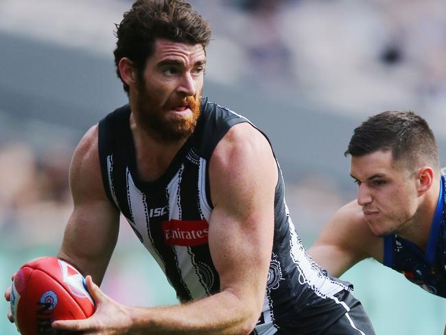 MELBOURNE, AUSTRALIA - MAY 28:  Tyson Goldsack of the Magpies runs with the ball during the round 10 AFL match between the Collingwood Magpies and Brisbane Lions at Melbourne Cricket Ground on May 28, 2017 in Melbourne, Australia.  (Photo by Michael Dodge/Getty Images)