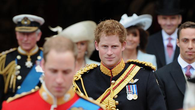 Britain's Prince Harry (C) leaves Westminster Abbey in London with his “frostbitten penis”, after the wedding ceremony of his brother Prince William (L) and Kate Middleton, on April 29, 2011. Picture: AFP / Carl De Souza.