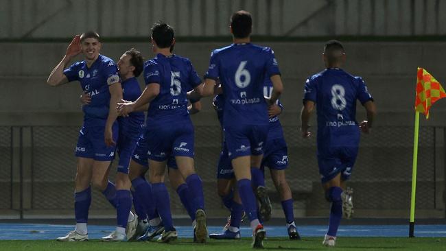 Harrison Sawyer celebrates scoring a goal for South Melbourne.