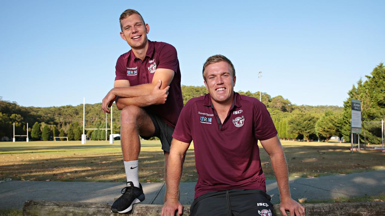 Tom Trbojevic and Jake Trbojevic posing for photos at Manly's training ground