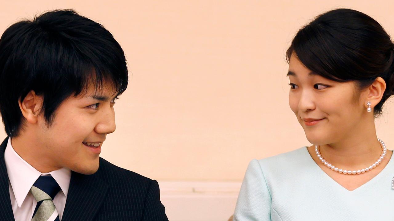 This file photo taken on September 3, 2017 shows Princess Mako (R), the eldest daughter of Prince Akishino and Princess Kiko, and her fiancee Kei Komuro (L), smiling during a press conference to announce their engagement. Picture: AFP Photo / Pool / Shizuo Kambayashi