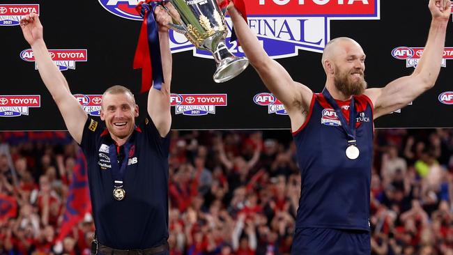 PERTH, AUSTRALIA - SEPTEMBER 25: Simon Goodwin, Senior Coach of the Demons and Max Gawn of the Demons hold the cup aloft during the 2021 Toyota AFL Grand Final match between the Melbourne Demons and the Western Bulldogs at Optus Stadium on September 25, 2021 in Perth, Australia. (Photo by Michael Willson/AFL Photos via Getty Images)