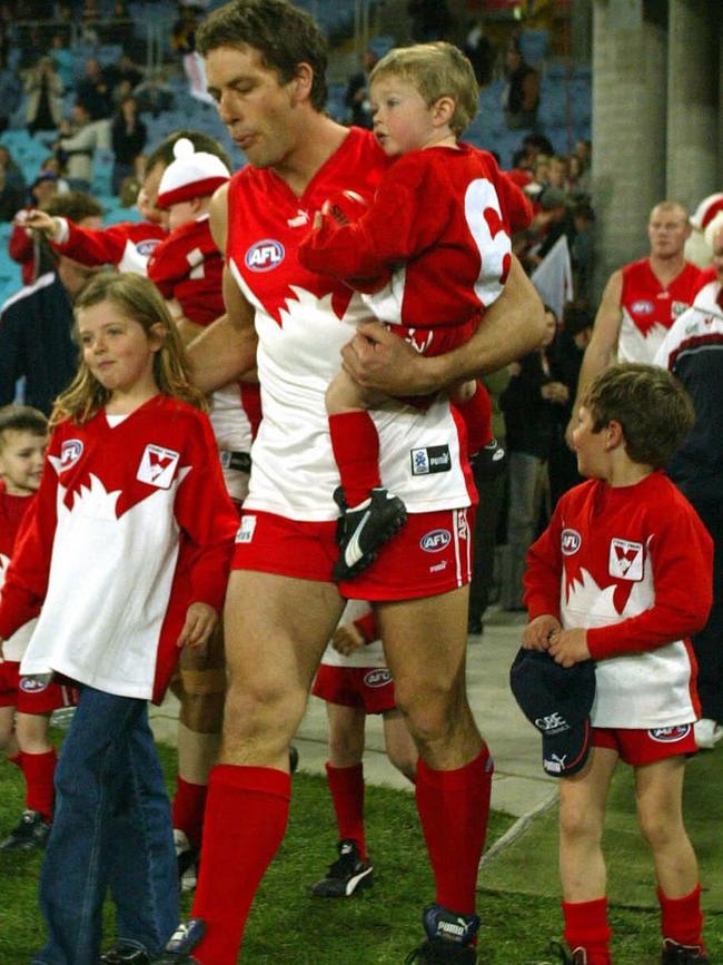 Josh Dunkley (right) walks out with father Andrew. Picture Mark Evans