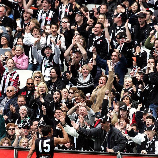 Chris Egan celebrates with the Collingwood Army at the MCG.