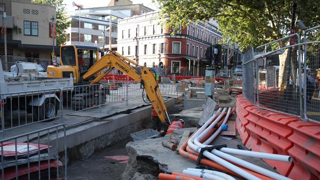 Light rail workers on site at Elizabeth and Chalmers streets Surry Hills where human bones were discovered during construction. Picture John Grainger