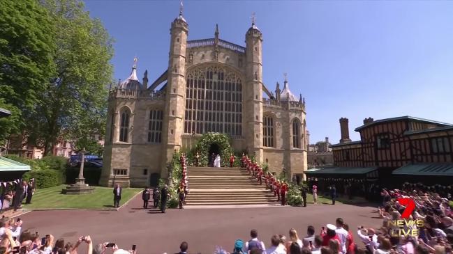 Harry and Meghan kiss on steps of St George's Chapel