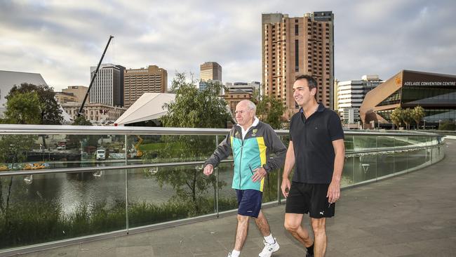 Former PM John Howard and Liberal leader Steven Marshall walk across the River Torrens in 2018. Picture: AAP Image