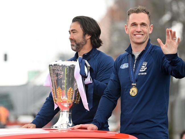 Chris Scott, Senior Coach of the Cats and Joel Selwood of the Cats show off the premiership cup during the Geelong Cats 2022 AFL Premiers Street Parade on September 27, 2022 in Geelong, Australia. Picture: Morgan Hancock