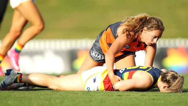 Ailish Considine of the Adelaide Crows lies injured after being tackled by Tarni Evans of the Giants during an AFLW match in 2021. Picture: Mark Kolbe/Getty Images