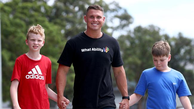 Former Parramatta Eels player Steve Dresler with kids Owen (L) and Joe. Picture: Toby Zerna