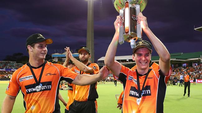 Scorchers quick Jhye Richardson with the BBL06 trophy.