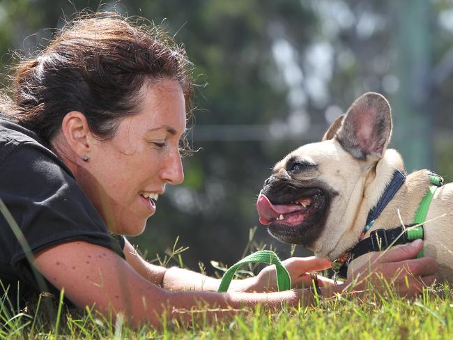 Maxine Fernandez plays with her dog. Pic: Martin Lange