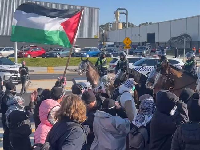 Pro-Palestine protestors have clashed with police outside a Dandenong South business. Picture: Fergis Ellis.