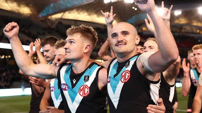 Ollie Wines and Sam Powell-Pepper enjoy Port Adelaide’s qualifying final win.