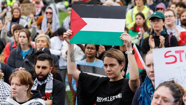 A protester with a Palestinian flag. Picture: NCA NewsWire / David Swift