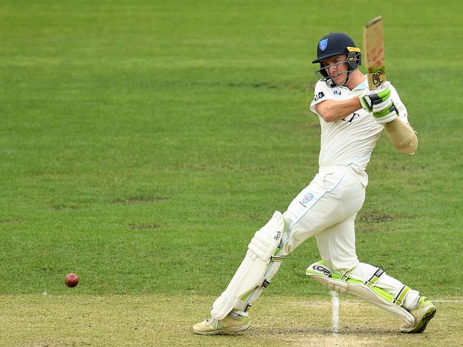 New South Wales batsman Baxter Holt plays a shot as Tasmanian wicket keeper Tim Paine looks on during day 2 of the Round 10 Sheffield Shield cricket match between Tasmania and New South Wales at Blundstone Arena in Hobart, Thursday, March 21, 2019. Picture: AAP IMAGE/DAVE HUNT