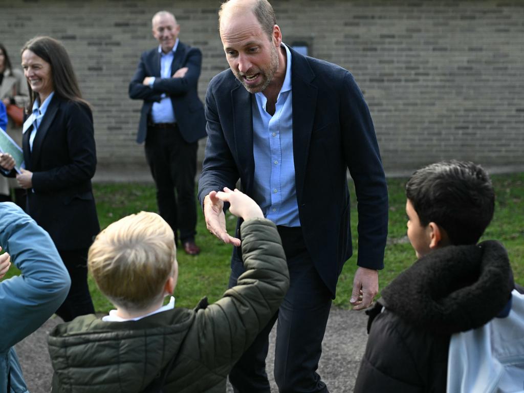 Prince William chats with schoolchildren after his visit to Birtley Community Pool. Picture: Getty Images