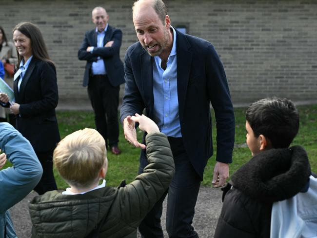 Prince William chats with schoolchildren after his visit to Birtley Community Pool. Picture: Getty Images