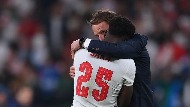 Southgate consols Saka after his penalty miss. Picture: AFP