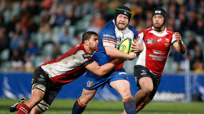 Rams prop Ben Robinson is tackled by Vikings flanker Jordan Smiler at Pirtek Stadium.