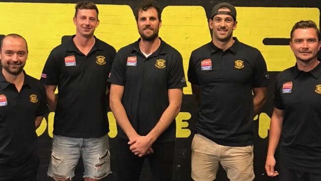 Banyule coach Paul Harris with Jack Langford, Scott Gumbleton, Tim Martin and Ricky Dyson. Picture: Supplied