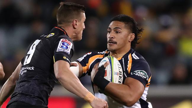 CANBERRA, AUSTRALIA - JUNE 22: Peter Samu of the Brumbies hands off Louis Schreuder of the Sharks during the Super Rugby Quarter Final match between the Brumbies and the Sharks at GIO Stadium on June 22, 2019 in Canberra, Australia. (Photo by Mark Metcalfe/Getty Images)