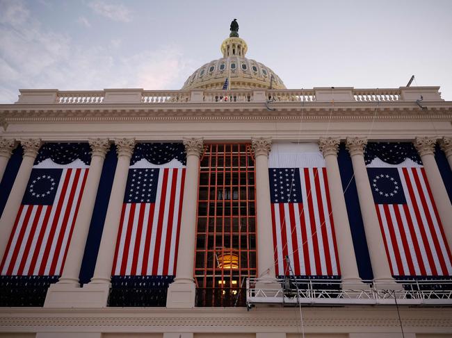 For large US flags are hung as the backdrop for the inauguration ceremony. Picture: Getty Images via AFP