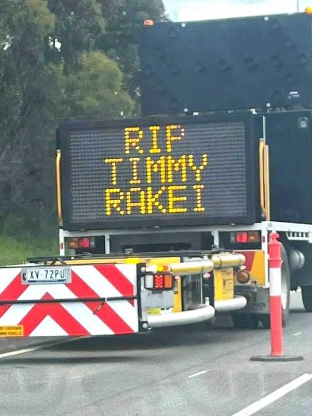 A tribute to victim Timmy Rakei on a road construction vehicle.