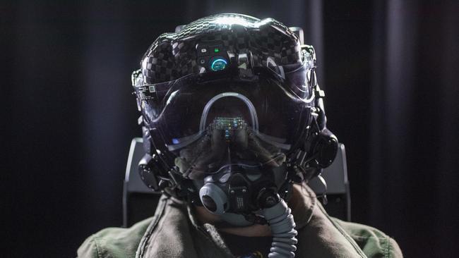 A pilot shows off the Gen III helmet for a Joint Strike Fighter F-35. Photo: Supplied