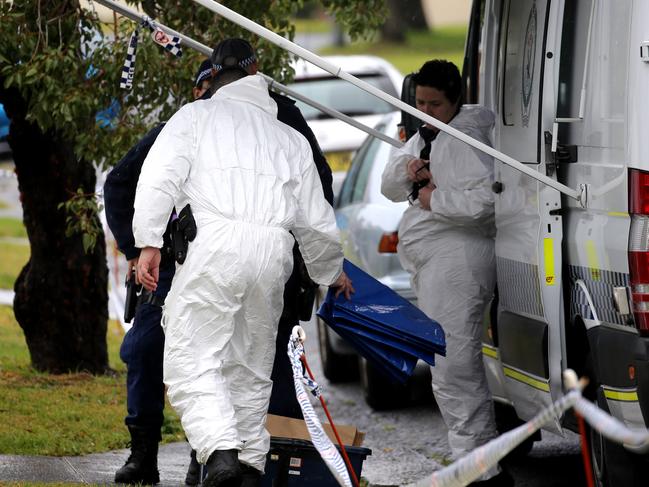 Forensic officers arrive at the Lorking Street address yesterday. John Grainger