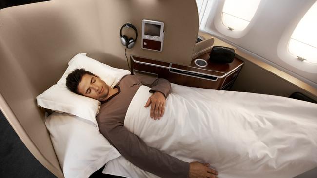 No, this isn’t my date but some totally handsome model booked by Qantas to look really attractive when he sleeps.