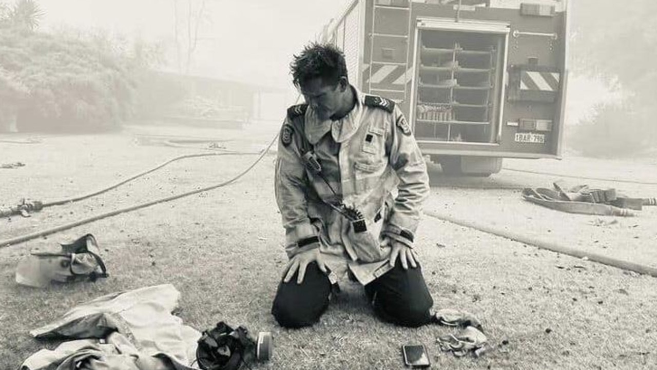 The now famous photo taken by career firefighter Mick Dybac of fellow senior firefighter David Ellis in front of a home they had just saved in the Wooroloo bushfire. Picture: Supplied by Department of Fire and Emergency Services via NCA NewsWire