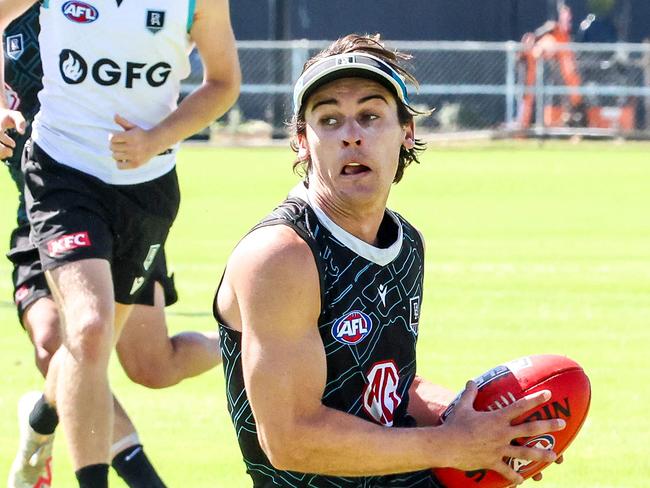 NEWS ADVPort training photosNew Port Adelaide captain Connor Rozee getting chased by Francis EvansImage/Russell Millard Photography