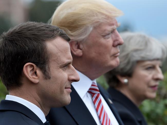 (L-R) French President Emmanuel Macron, US President Donald Trump and Britain's Prime Minister Theresa May.  Picture:  AFP