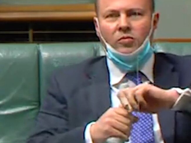 Josh Frydenberg struggles to open a bottle of water.