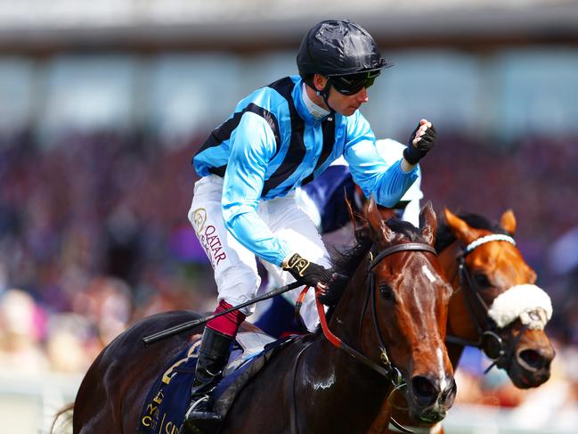 ASCOT, ENGLAND - JUNE 18: Oisin Murphy riding Asfoora celebrates winning the King Charles III Stakes during Royal Ascot 2024 at Ascot Racecourse on June 18, 2024 in Ascot, England. (Photo by Bryn Lennon/Getty Images)