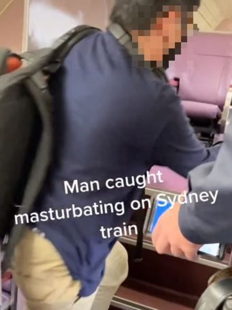 The man was escorted off the train by police. Picture: Billy Burner/TikTok