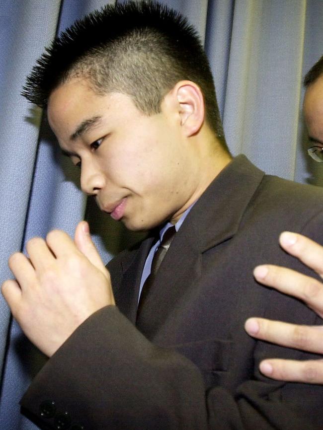 Sef Gonzales is supported by an uncle as he leaves a police press conference on his family’s murders. Picture: Mark Williams 