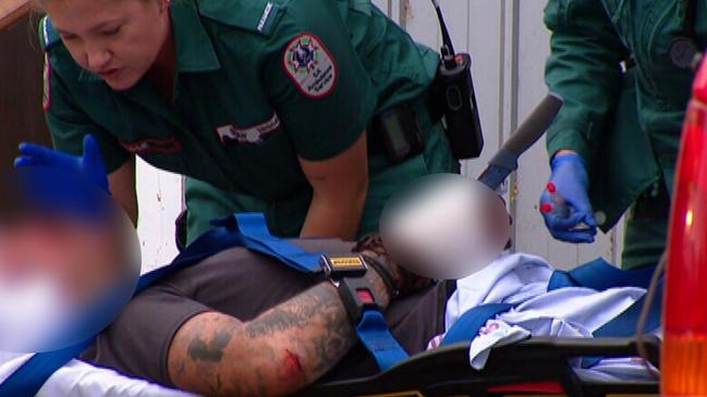 A man has been rushed to hospital with a knife lodged in his hand after an alleged assault in his home. Picture: 9News.