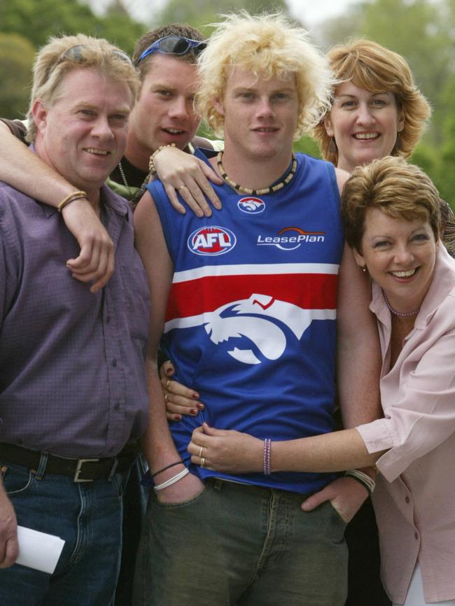 Adam Cooney after the draft with dad Paul, brother Ben, mum Mel and mum Chris — and that necklace.